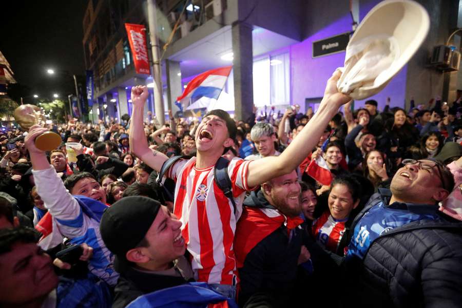 Paraguayan fans celebrate their country's win at the World Cup.