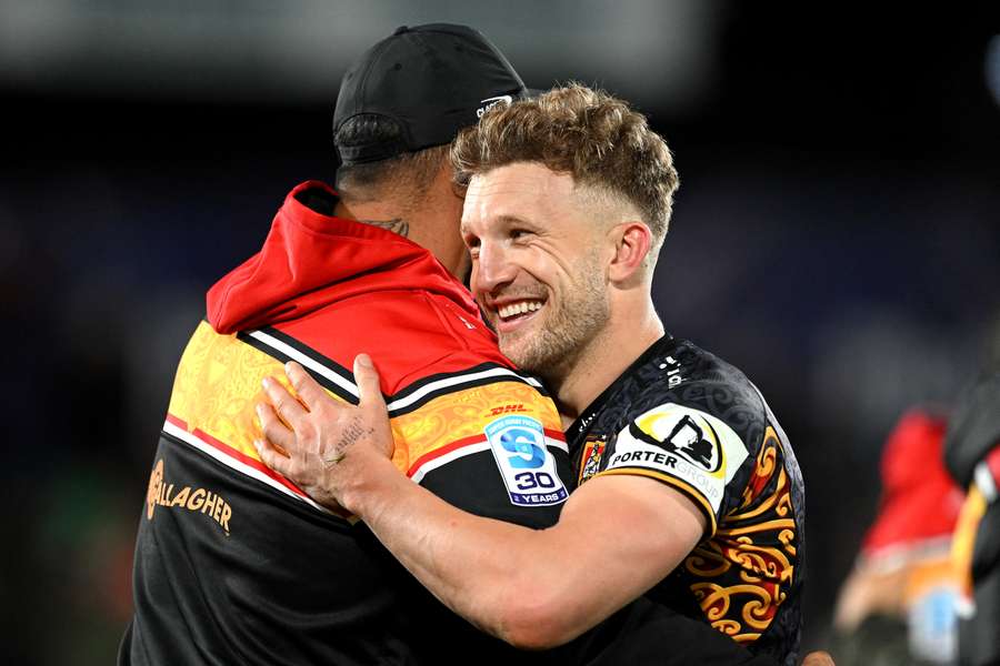 Chiefs flyhalf Damian McKenzie celebrates the team's super point win.