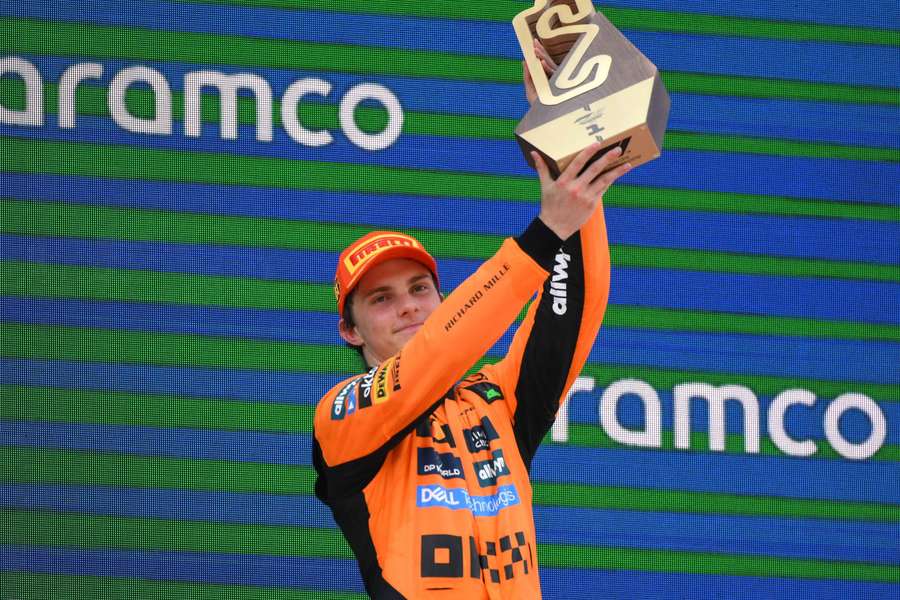 Oscar Piastri lifts the trophy after winning the Spanish Grand Prix on Sunday