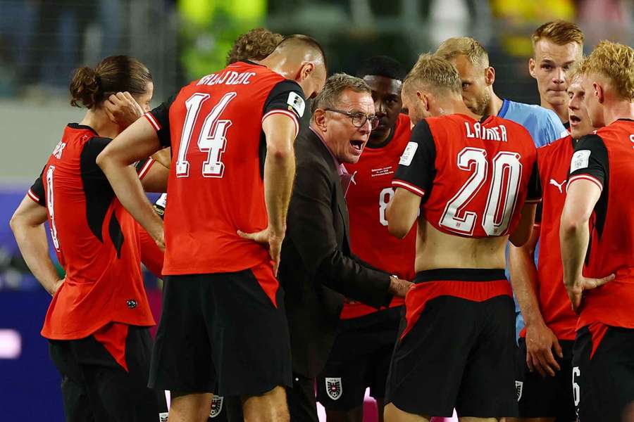 Austria head coach Ralf Rangnick talks to his team during hydration break Austria head coach Ralf Rangnick talks to his team during hydration break