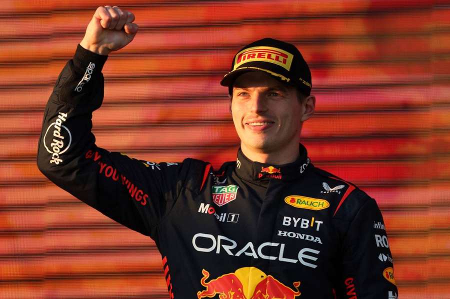 Max Verstappen celebrates his victory on the podium