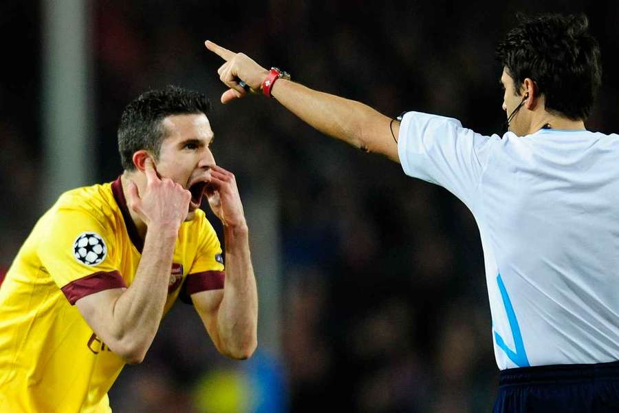 Arsenal's Robin van Persie fumes at referee Massimo Busacca after he was controversially sent off against Barcelona in 2011 Arsenal's Robin van Persie fumes at referee Massimo Busacca after he was controversially sent off against Barcelona in 2011