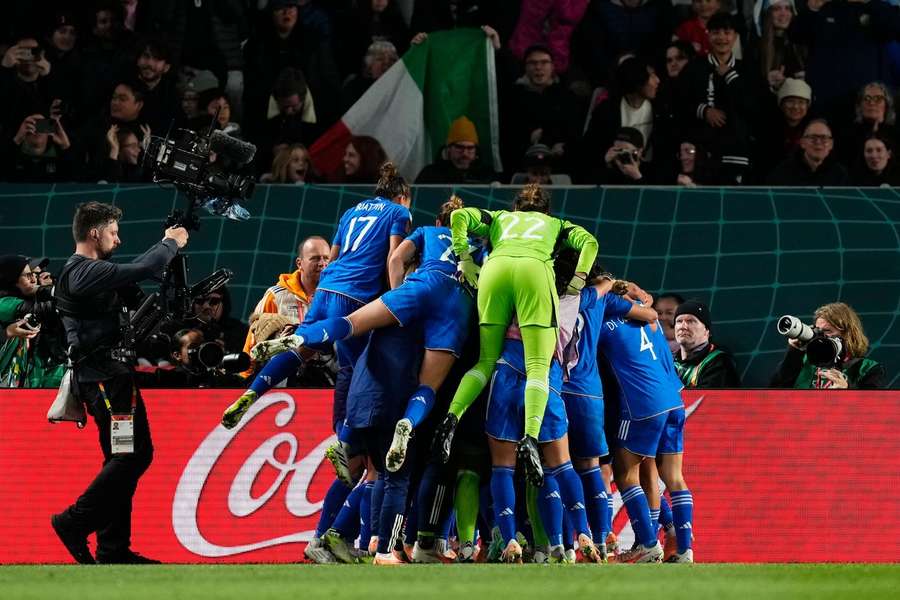 Italy celebrate their late goal