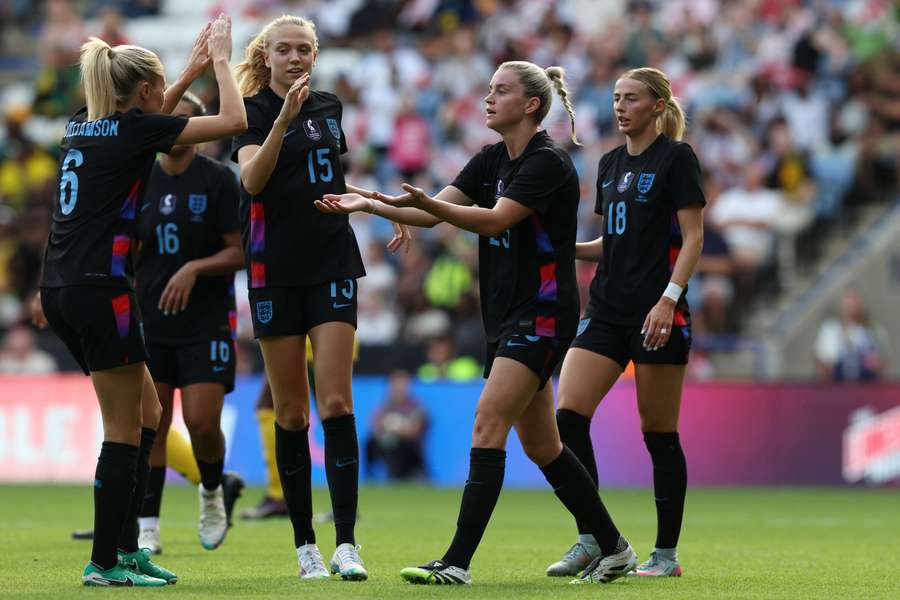 Alessia Russo (2R) celebrates with teammates after scoring England's fifth goal