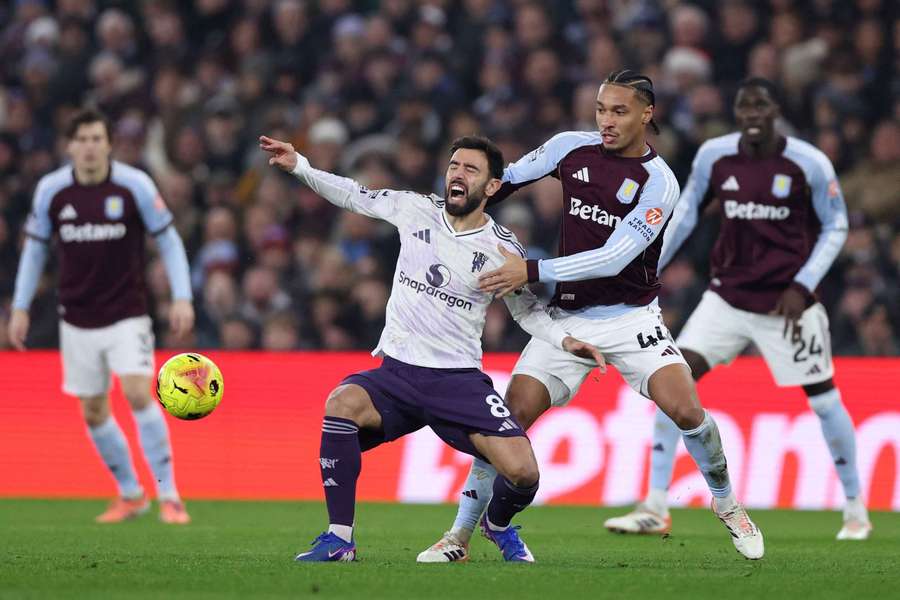 Bruno Fernandes goes down injured during the Aston Villa clash