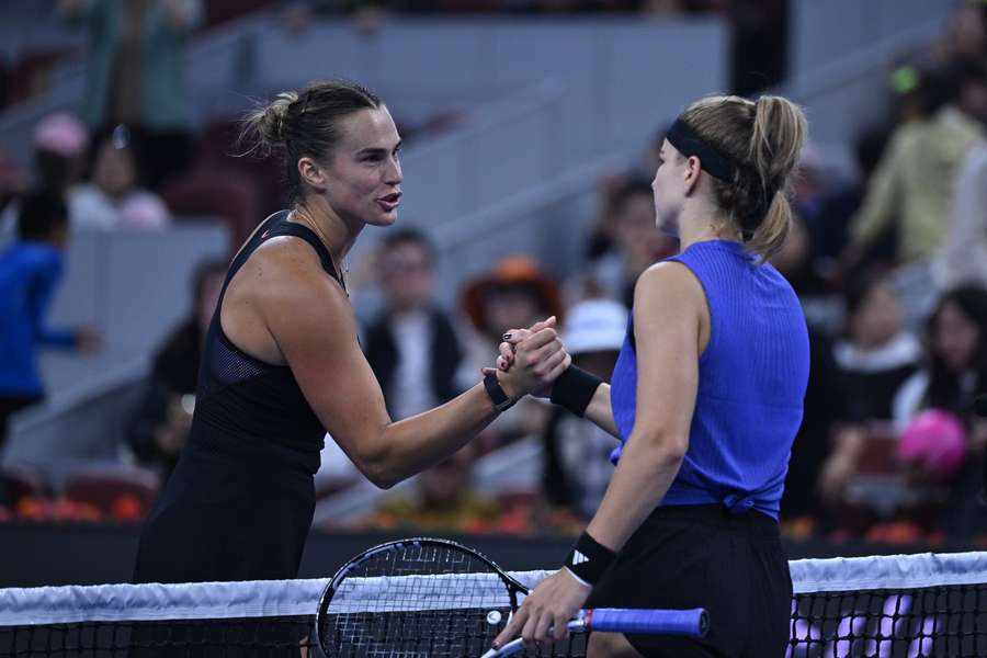 Sabalenka and Muchova embrace at the net