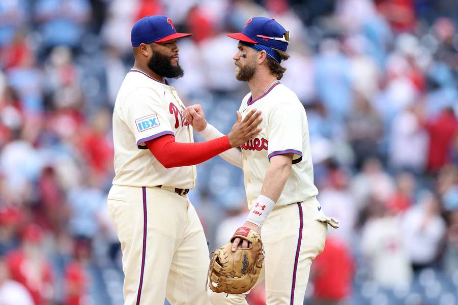 Jose Alvarado (left) celebrates with Bryce Harper (right) after a win (2025)
