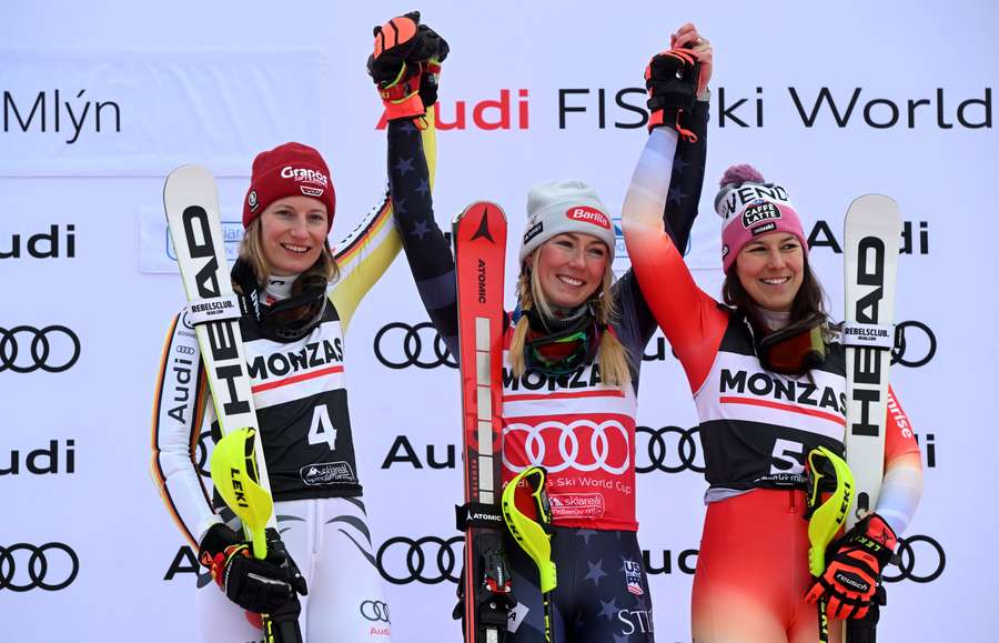 Second placed Germany's Lena Duerr, winner US' Mikaela Shiffrin and third placed Switzerland's Wendy Holdener celebrate on the podium 