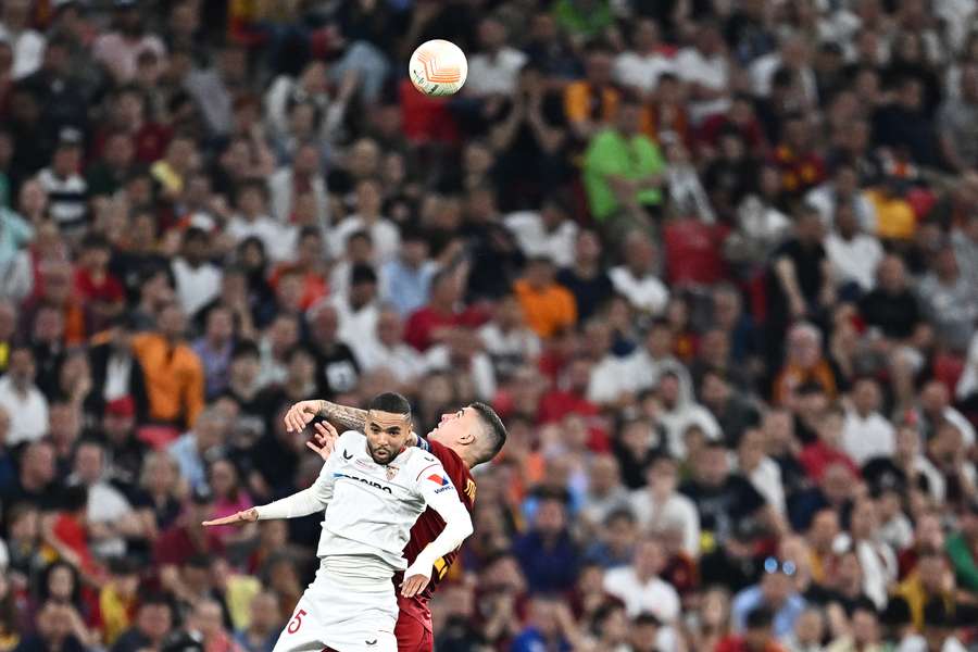 Sevilla's Bryan Gil and Roma's Gianluca Mancini jump for the ball