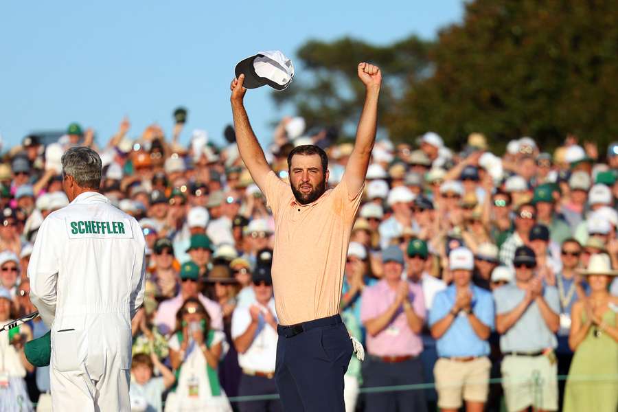 Scottie Scheffler of the United States celebrates on the 18th green after winning the 2024 Masters Tournament