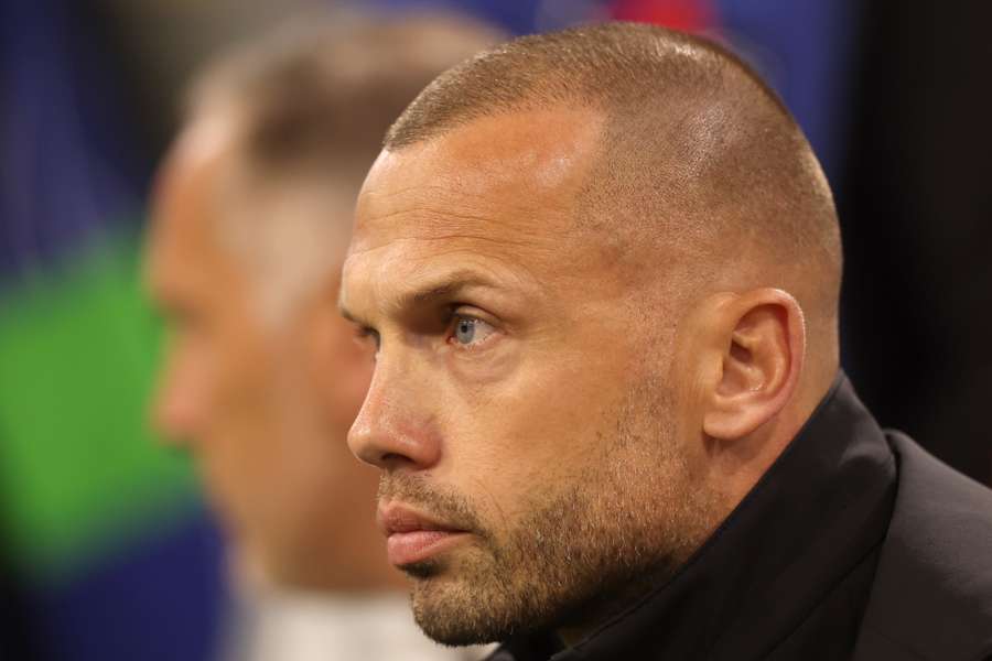 John Heitinga watches on during the Champions League game between Ajax and Inter