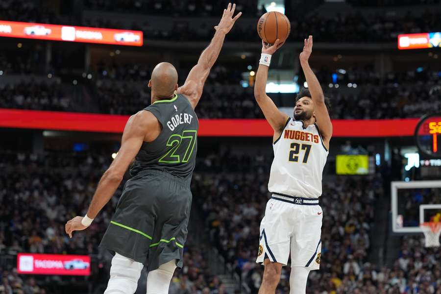 Nuggets' Jamal Murray shoots over Timberwolves' Rudy Gobert in Game 1 of 2026 NBA Playoffs series