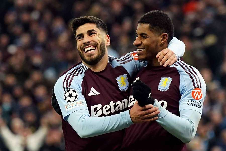 Aston Villa's Marco Asensio celebrates scoring in the Champions League with teammate Marcus Rashford