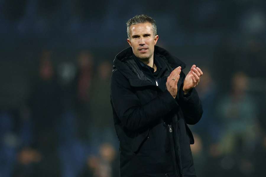 Feyenoord coach Robin van Persie applauds the fans after his side's defeat to Celtic in the Europa League.