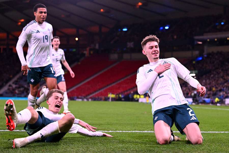 Conor Bradley celebrates scoring a goal against Scotland in Glasgow