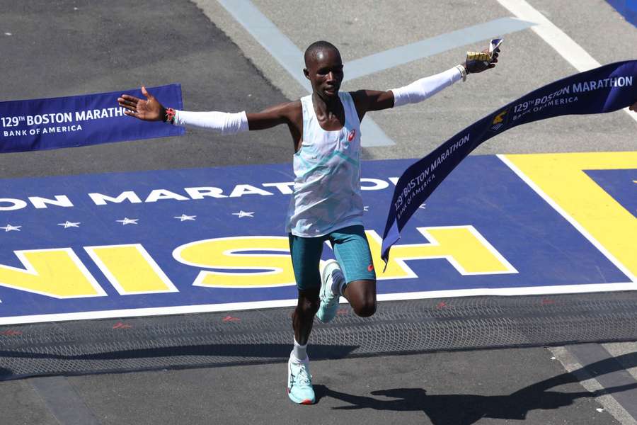 Kenya's John Korir crosses the line to win the men's category in the Boston Marathon 