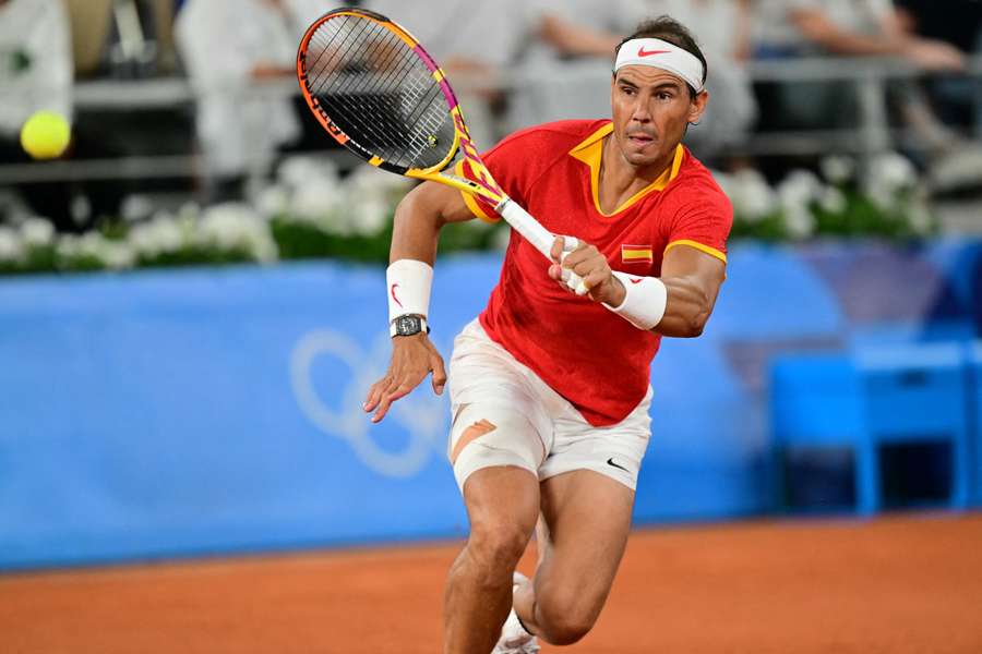 Spain's Rafael Nadal playing with Spain's Carlos Alcaraz returns to Argentina's Maximo Gonzalez and Argentina's Andres Molteni 