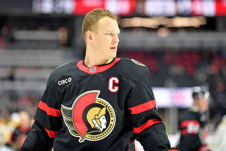 Senators' Brady Tkachuk looks on before a game