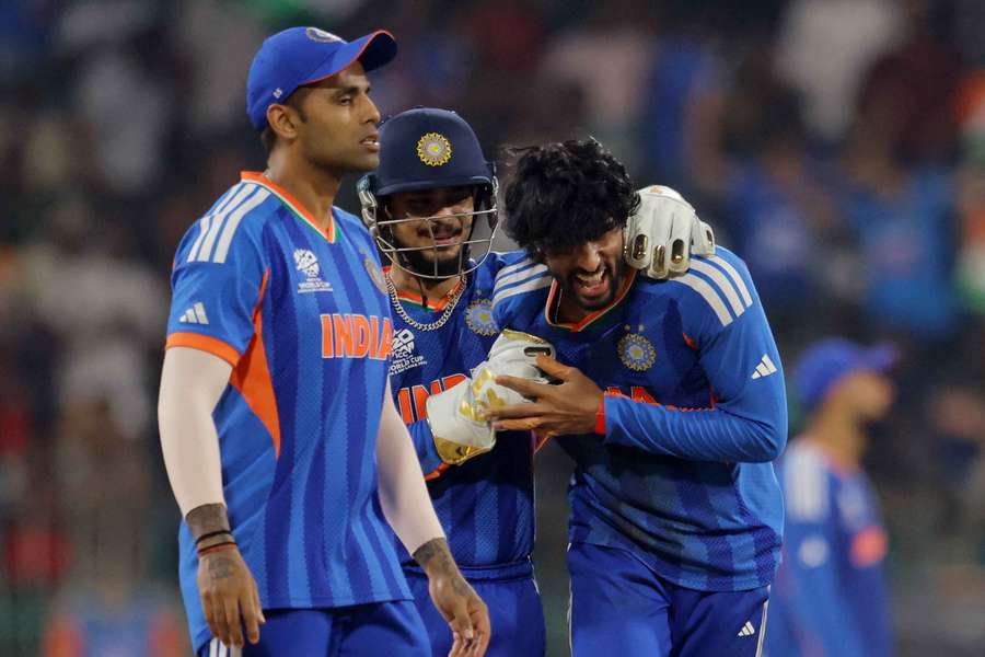 India's Tilak Varma celebrates with Ishan Kishan after dismissing Pakistan's Shadab Khan