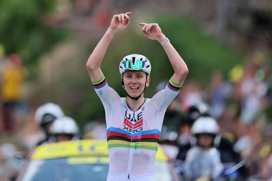 Tadej Pogacar celebrates after crossing the finish line to win stage six Tadej Pogacar celebrates after crossing the finish line to win stage six