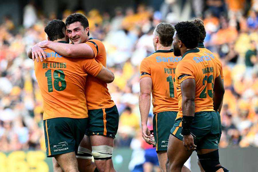 Australia's 1000th Wallaby, Massimo De Lutiis, celebrates a try scored on international debut. Australia's 1000th Wallaby, Massimo De Lutiis, celebrates a try scored on international debut.