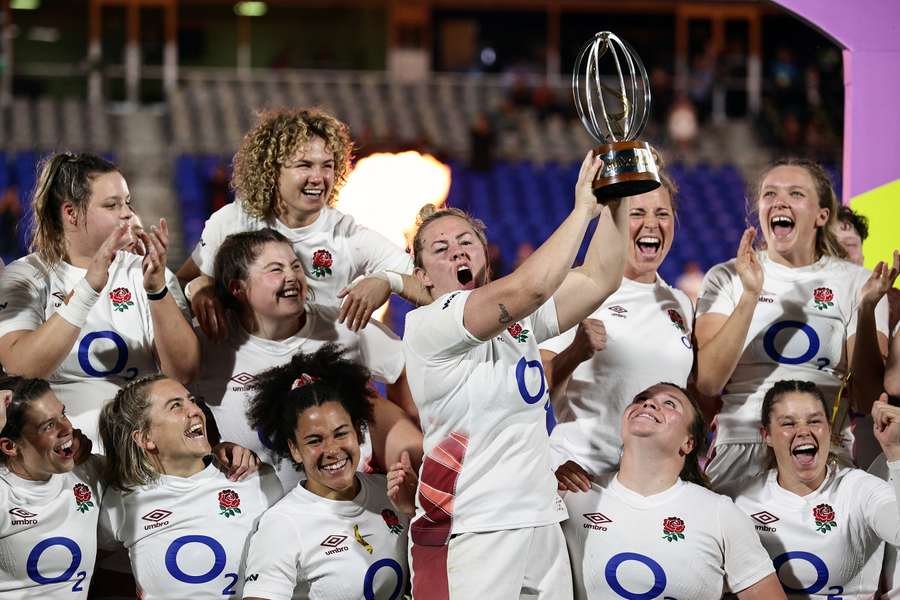 England captain Marlie Packer celebrates with the WXV trophy