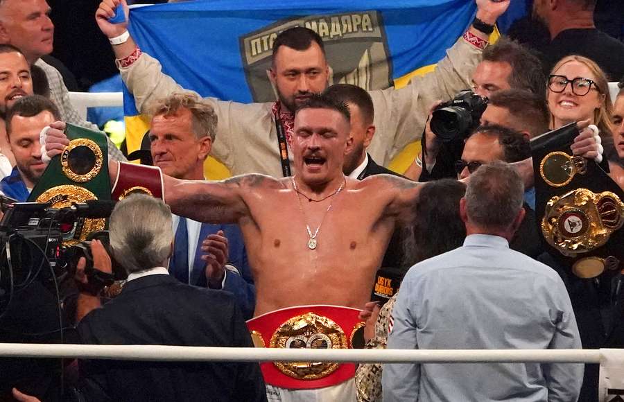 Ukraine’s reigning world heavyweight champion Oleksandr Usyk celebrates winning his fight against challenger Daniel Dubois