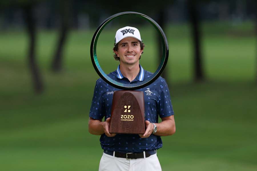 Colombia's Nico Echavarria poses with the trophy after the final round of the Zozo Championship