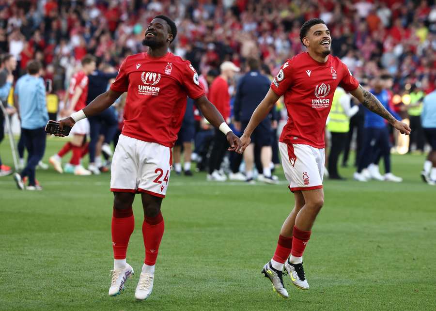 Nottingham Forest's Ivorian Coast defender Serge Aurier (L) and Nottingham Forest's English midfielder Morgan Gibbs-White celebrate after the English Premier League football match between Nottingham Forest and Arsenal