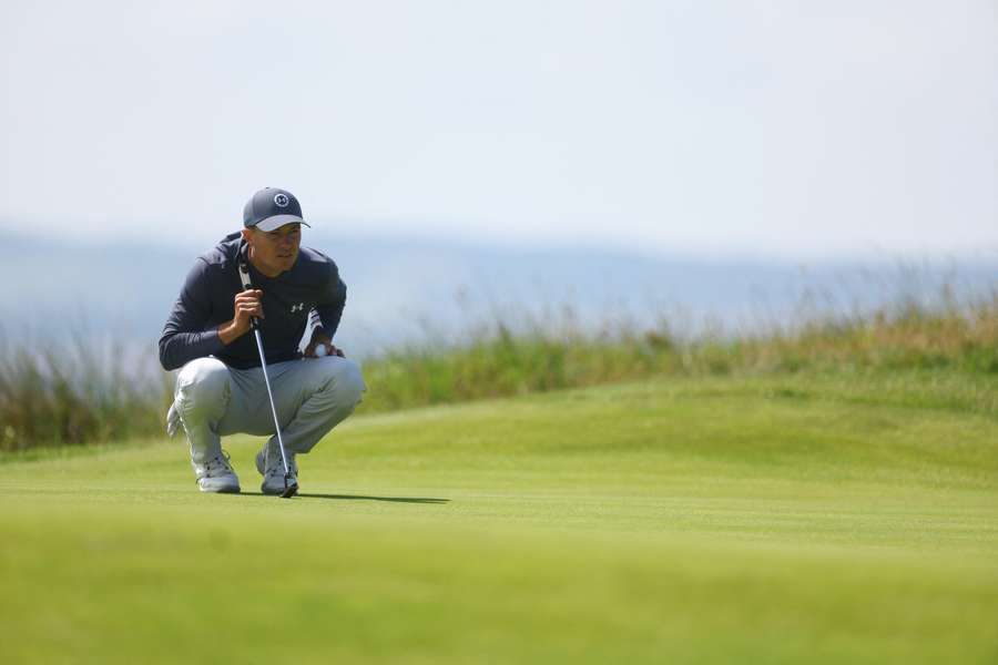 Jordan Spieth eyes up a putt at Hoylake