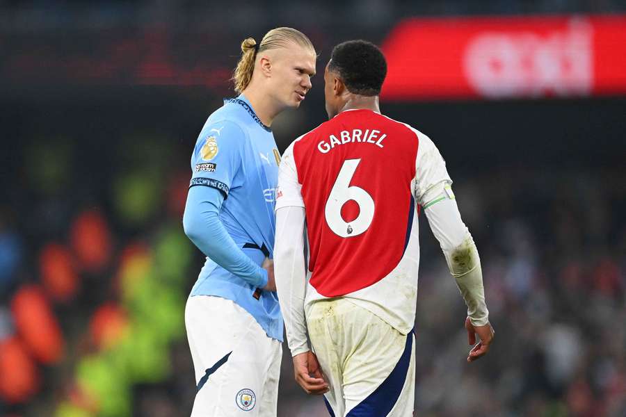 Manchester City's Erling Haaland clashes with Arsenal's Gabriel