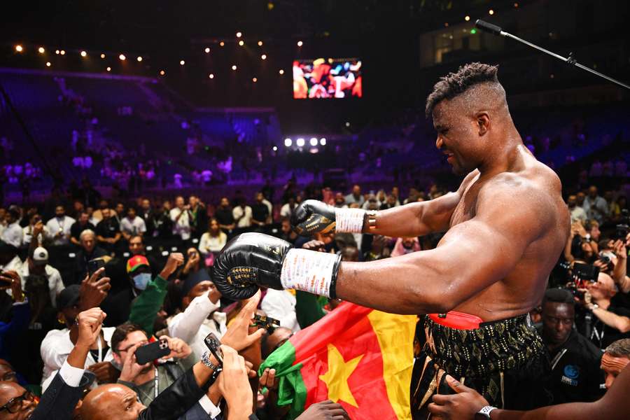 Ngannou (R) looks out to the crowd in Saudi Arabia