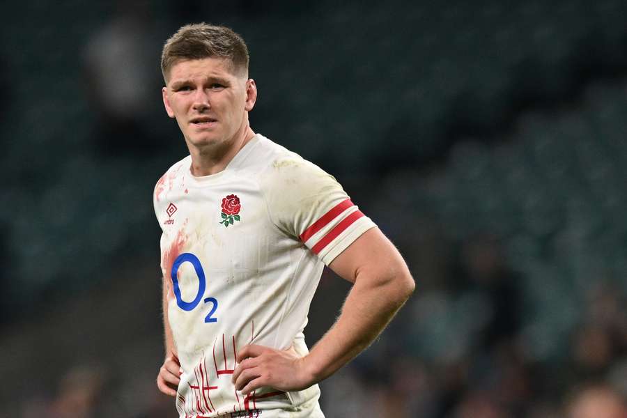 England's centre Owen Farrell reacts at the end of the Six Nations defeat to Scotland