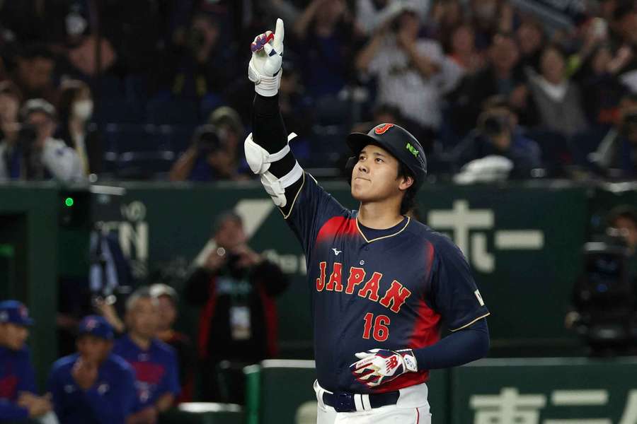 Shohei Ohtani celebrates his grand slam for Japan