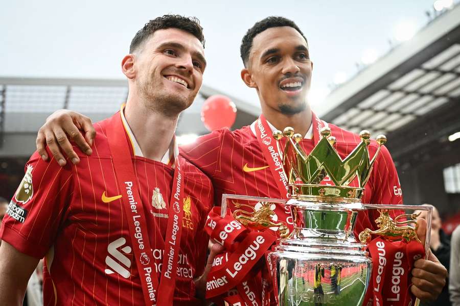 Liverpool's Andrew Robertson and Trent Alexander-Arnold celebrate with the Premier League trophy Liverpool's Andrew Robertson and Trent Alexander-Arnold celebrate with the Premier League trophy