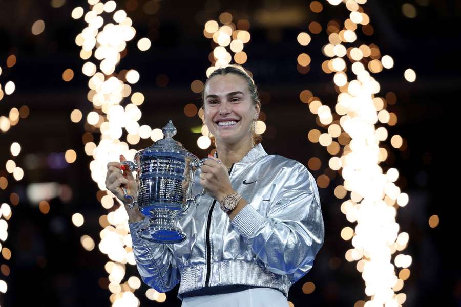 Aryna Sabalenka celebrates with the trophy after winning the women's singles final at the US Open