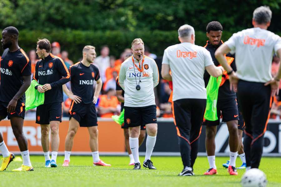 Netherlands manager Ronald Koeman (centre) leads the practice