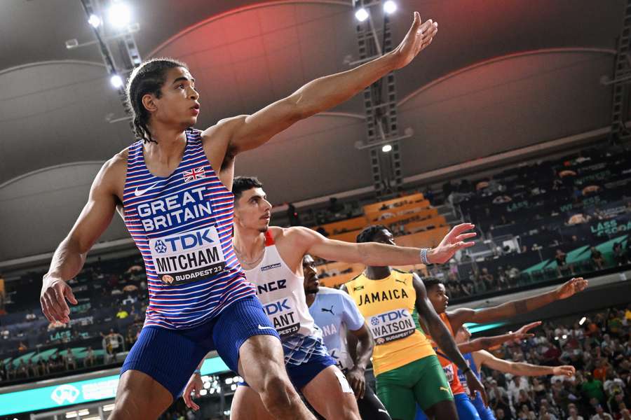 Britain's Rio Mitcham and France's Teo Andant prepare to receive the baton on the final leg in the men's 4x400m relay final