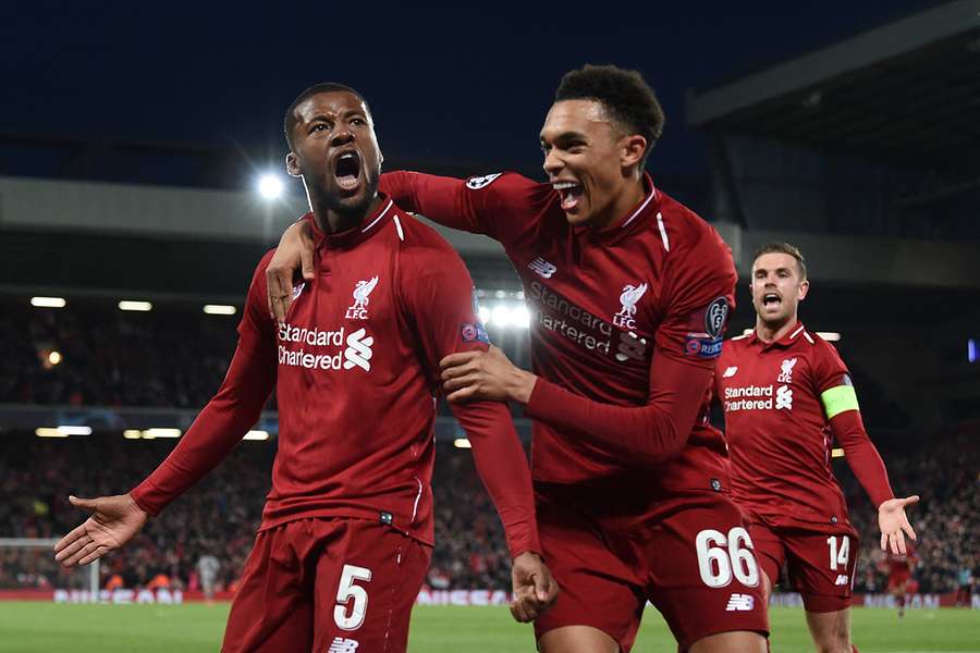 Gini Wijnaldum, Trent Alexander-Arnold and Jordan Henderson of Liverpool celebrate (2019)