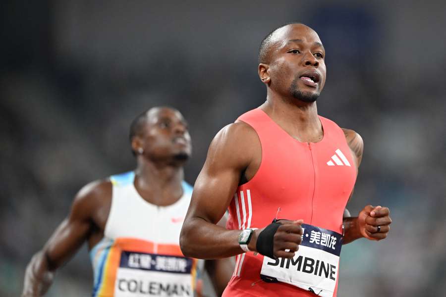 Akani Simbine (front) crosses the line to win the men's 100m