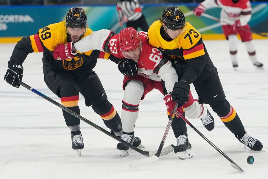 Denmark's Patrick Russell challenges Germany's Lukas Reichel and Lukas Kalble