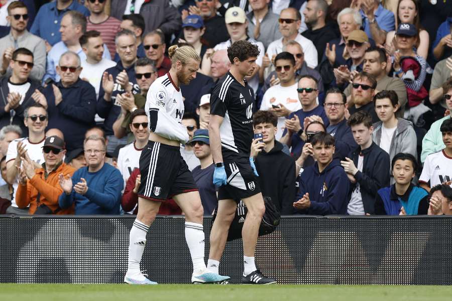 Fulham's Tim Ream walks off the pitch after sustaining the injury 