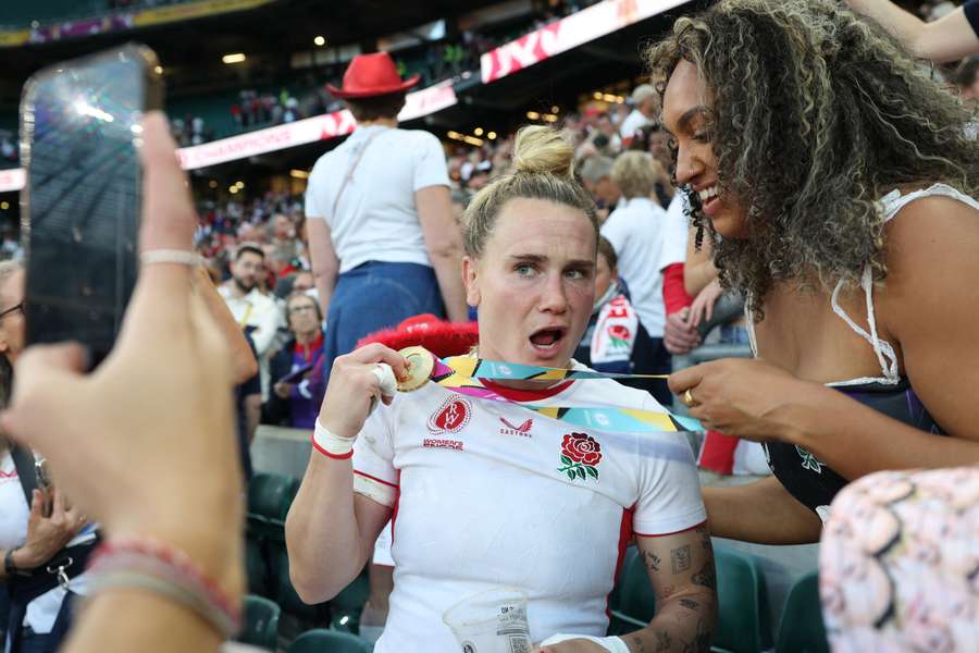 England centre Megan Jones (L) celebrates after the Women's Rugby World Cup final win over Canada in September