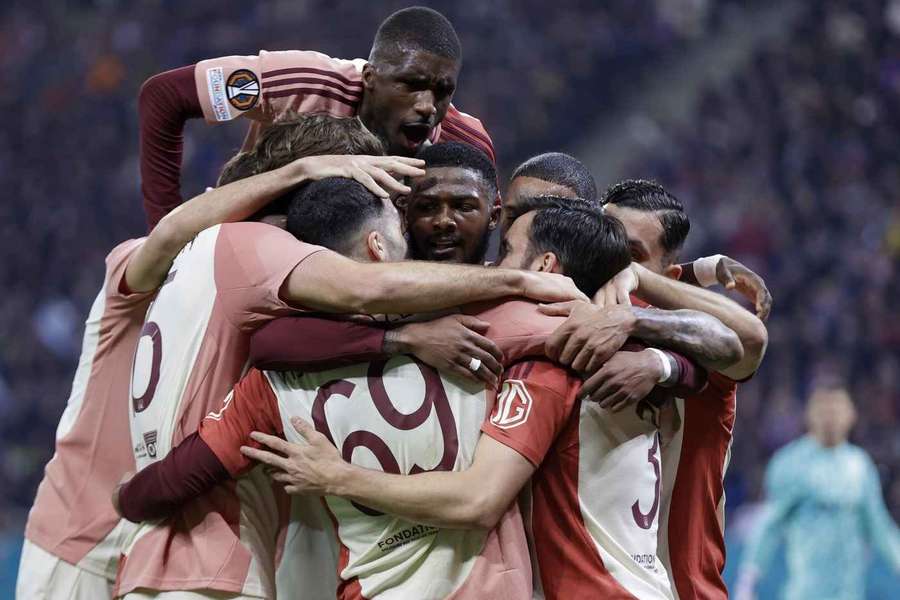 Lyon players celebrate after scoring against FCSB