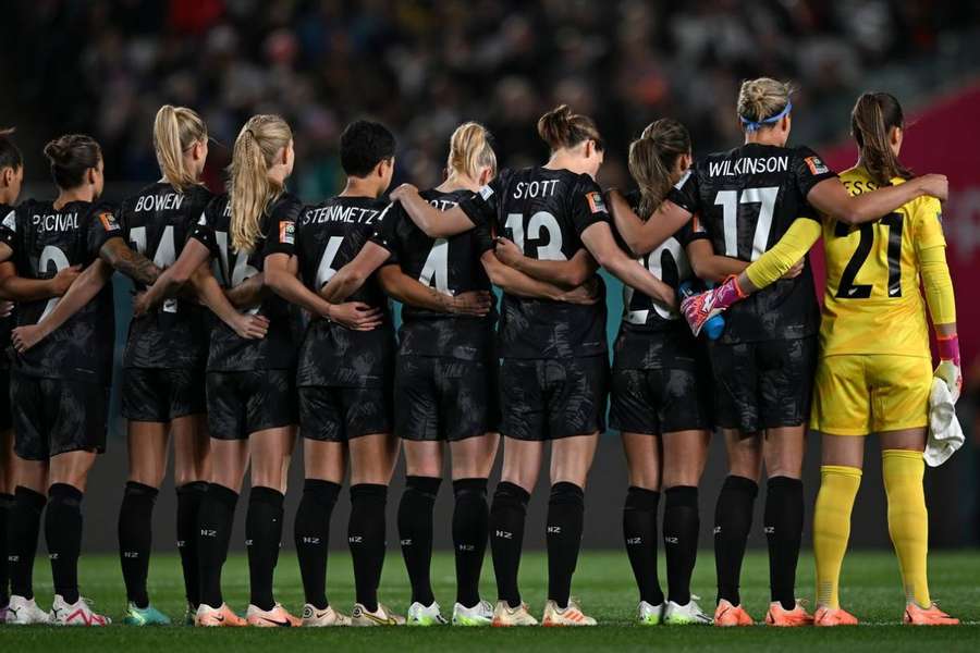 New Zealand players observe a moment of silence for the victims of a shooting attack in Auckland ahead of their opening World Cup match