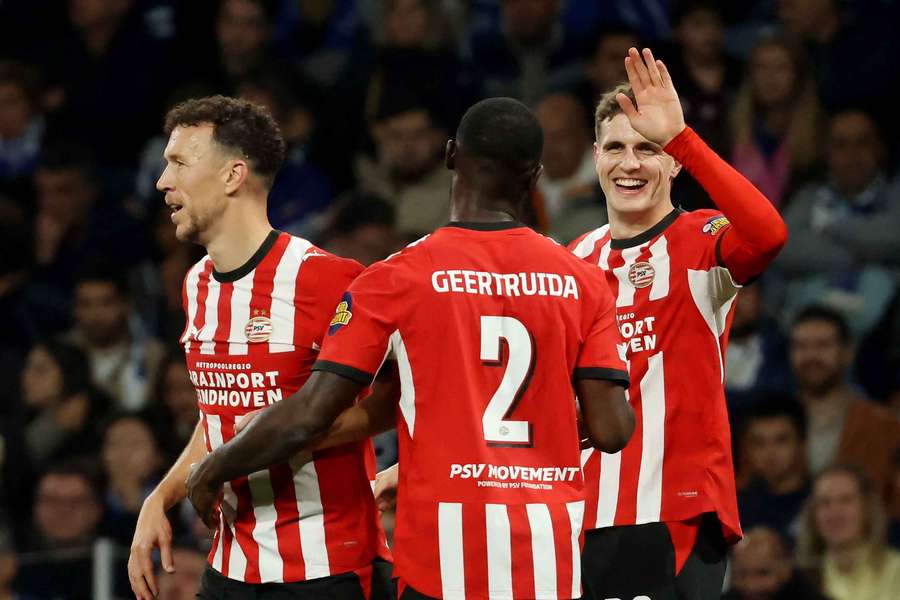PSV celebrate Guus Til's (R) goal against Porto