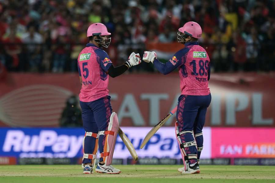 Rajasthan Royals' Riyan Parag (L) and Shimron Hetmyer bump their fists