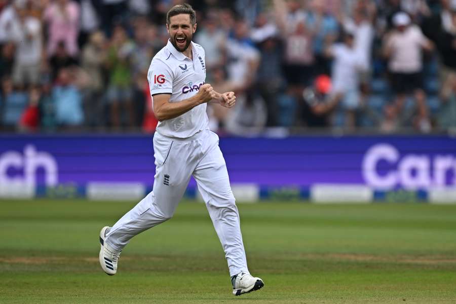 England's Chris Woakes celebrates the wicket of Australia's Mitchell Marsh