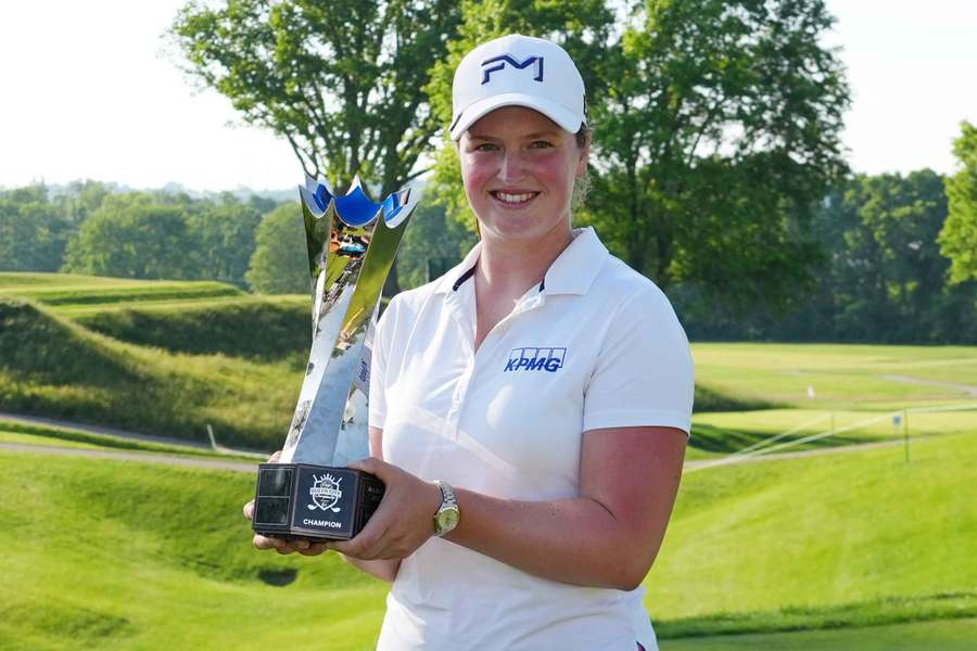 Lottie Woad poses with the trophy after winning the Queen City Championship Lottie Woad poses with the trophy after winning the Queen City Championship