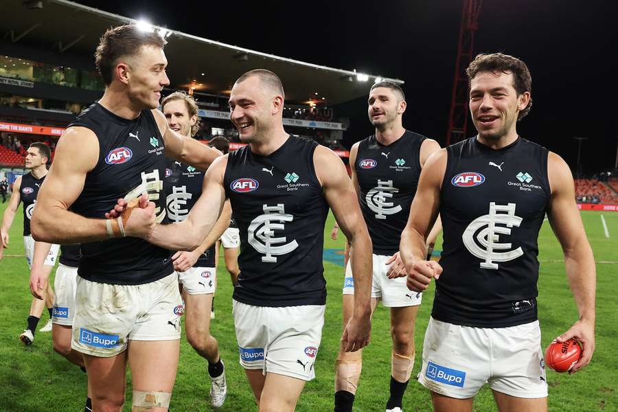 Patrick Cripps, Will Hayward and Oliver Florent celebrate Carlton's fifth consecutive victory. Patrick Cripps, Will Hayward and Oliver Florent celebrate Carlton's fifth consecutive victory.